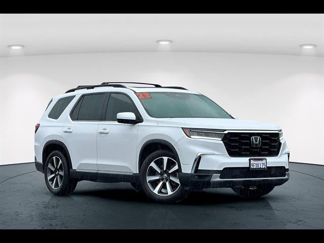2023 Honda Pilot Elite in White — front three-quarter view